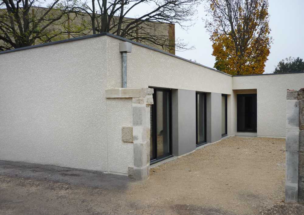 Une maison avec une extension réalisée par Moyse 3D